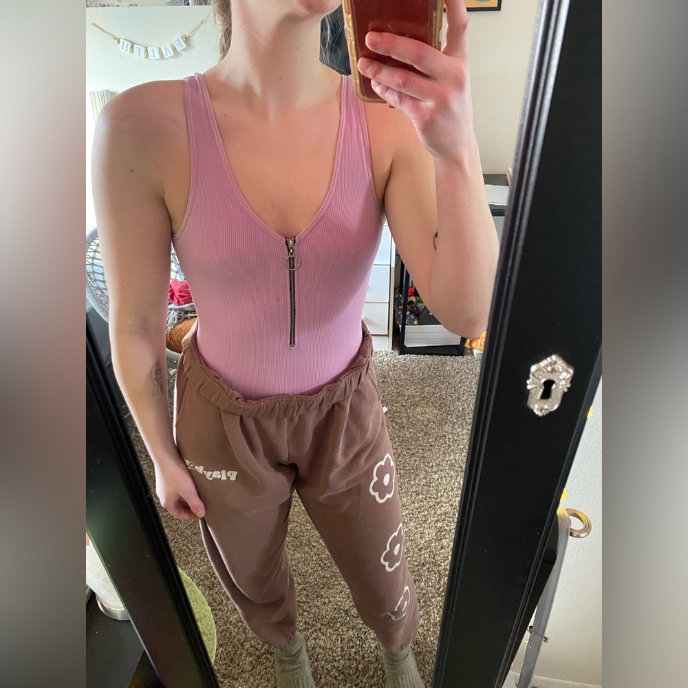 Size S, purple zip up body suit